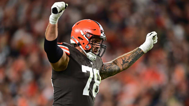 Browns offensive tackle Jack Conklin (78) celebrates after a touchdown scored by Amari Cooper.